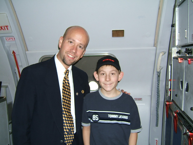 Erik Per Sullivan with flight attendant 'Sluggo' (2004)